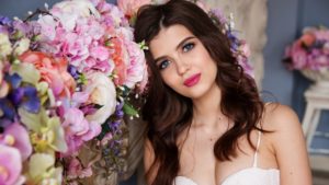 bride near beautiful flowers