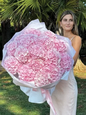 Luxurious Pink Cloud bouquet featuring soft pink hydrangeas in elegant wrapping, perfect for romantic occasions and French Riviera delivery