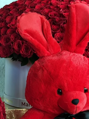 Close-up of 70cm red plush bunny with black satin bow and Manakin Fleurs luxury red rose boxes, romantic Valentine's Day gift for Saint-Jean-Cap-Ferrat villas
